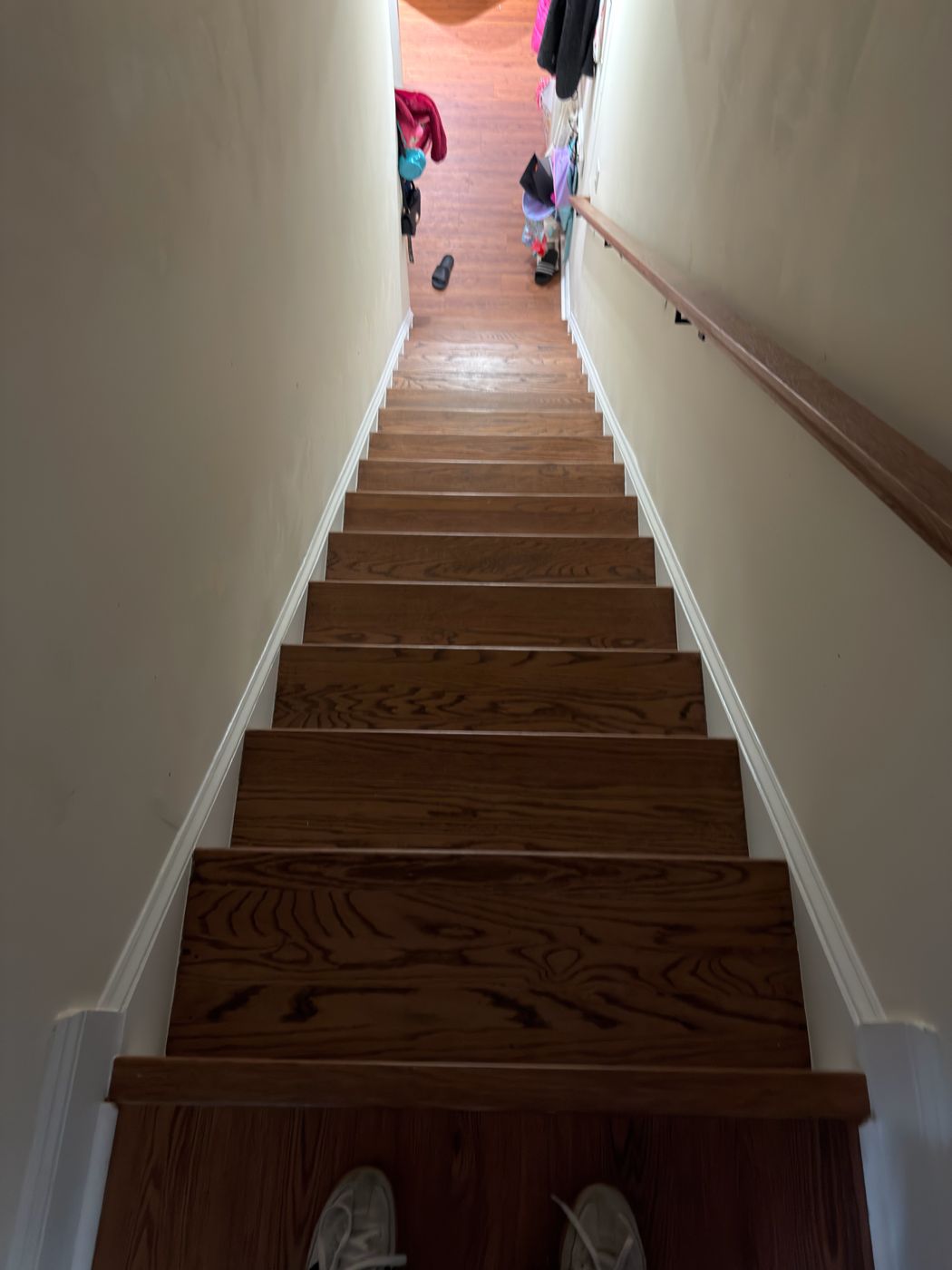 Same stairwell after: new oak treads with white risers